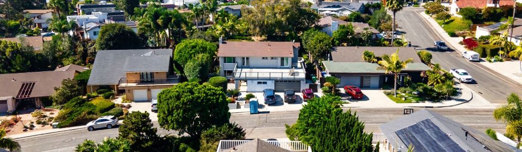 Aerial view of a suburban backyard with space for a second small house or guest unit