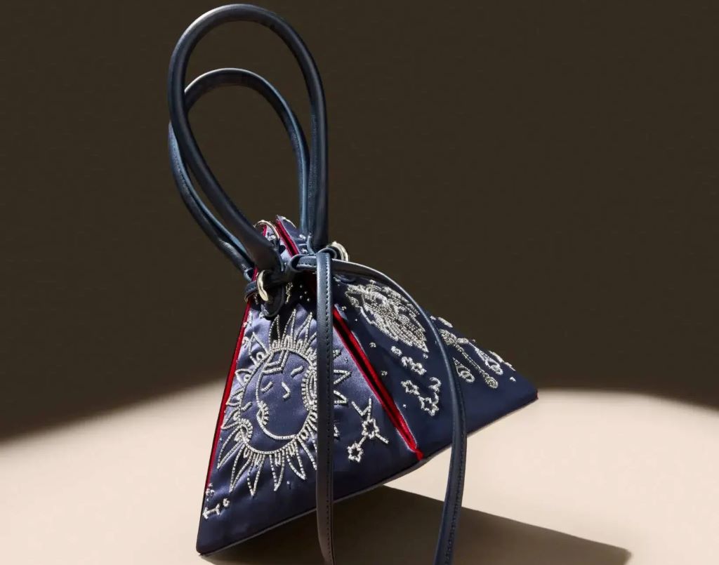 Collection of iconic designer bags showing luxury brand pyramid tiers and investment pieces