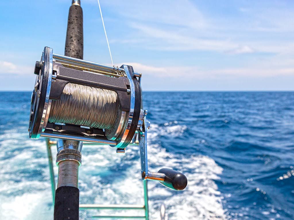 Angler setting up a baitcasting reel with durable fishing line